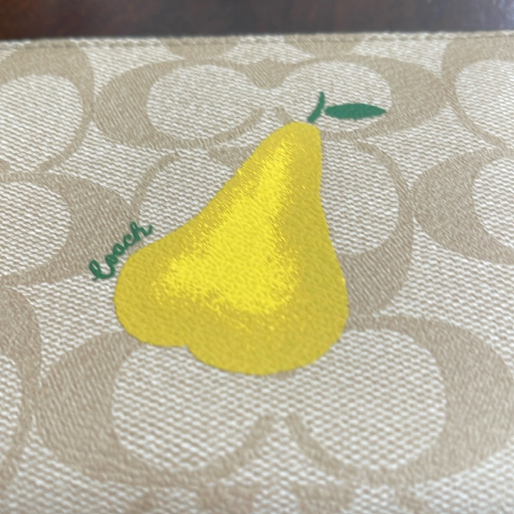 Authentic Coach corner zip wristlet. Yellow pear. Light khaki. 6”x4” never used